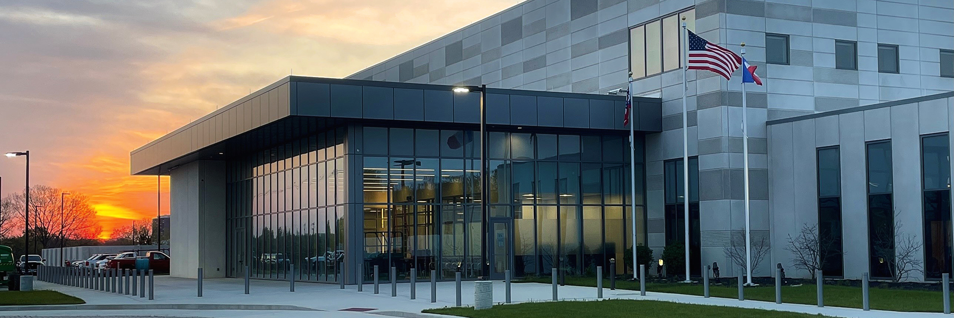 A photo of the James A. Karnes Corrections Center at sunrise